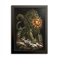 Black-framed print of a muscular green lion standing on snow-covered rocks among winter pines, biting a golden sun with a calm human face, in engraved-style detail on black.