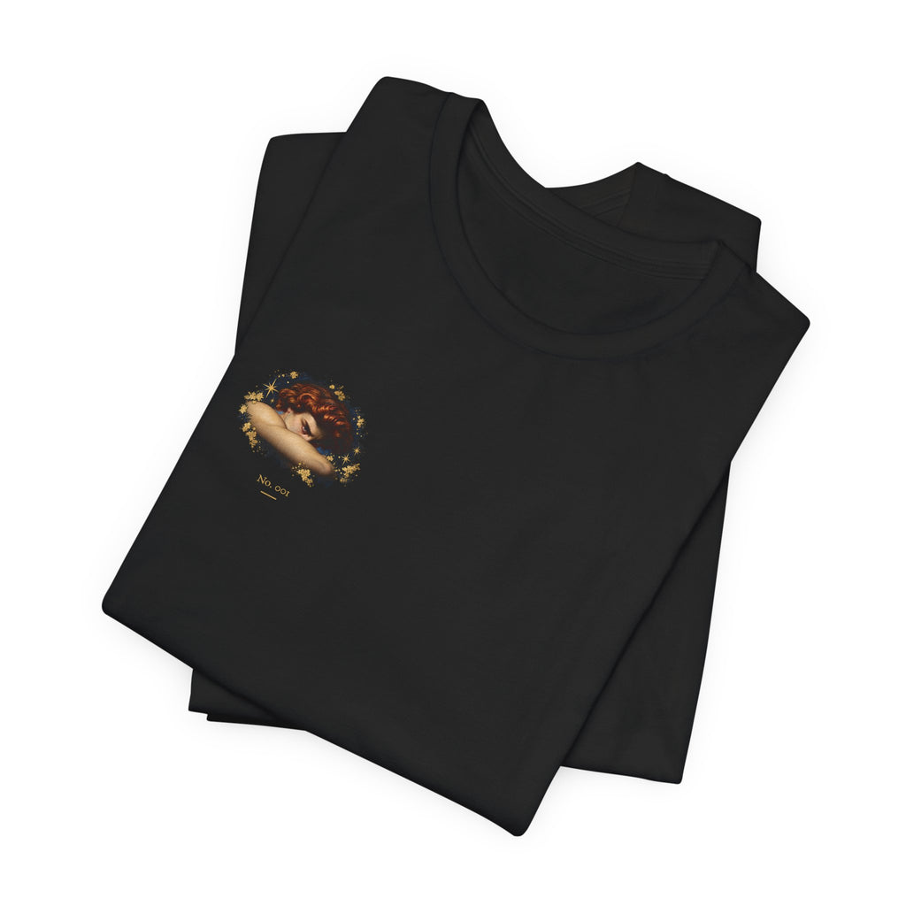 Folded black Old Heaven No. 001 T-shirt with the auburn portrait and gold stars on the wearer's right chest.