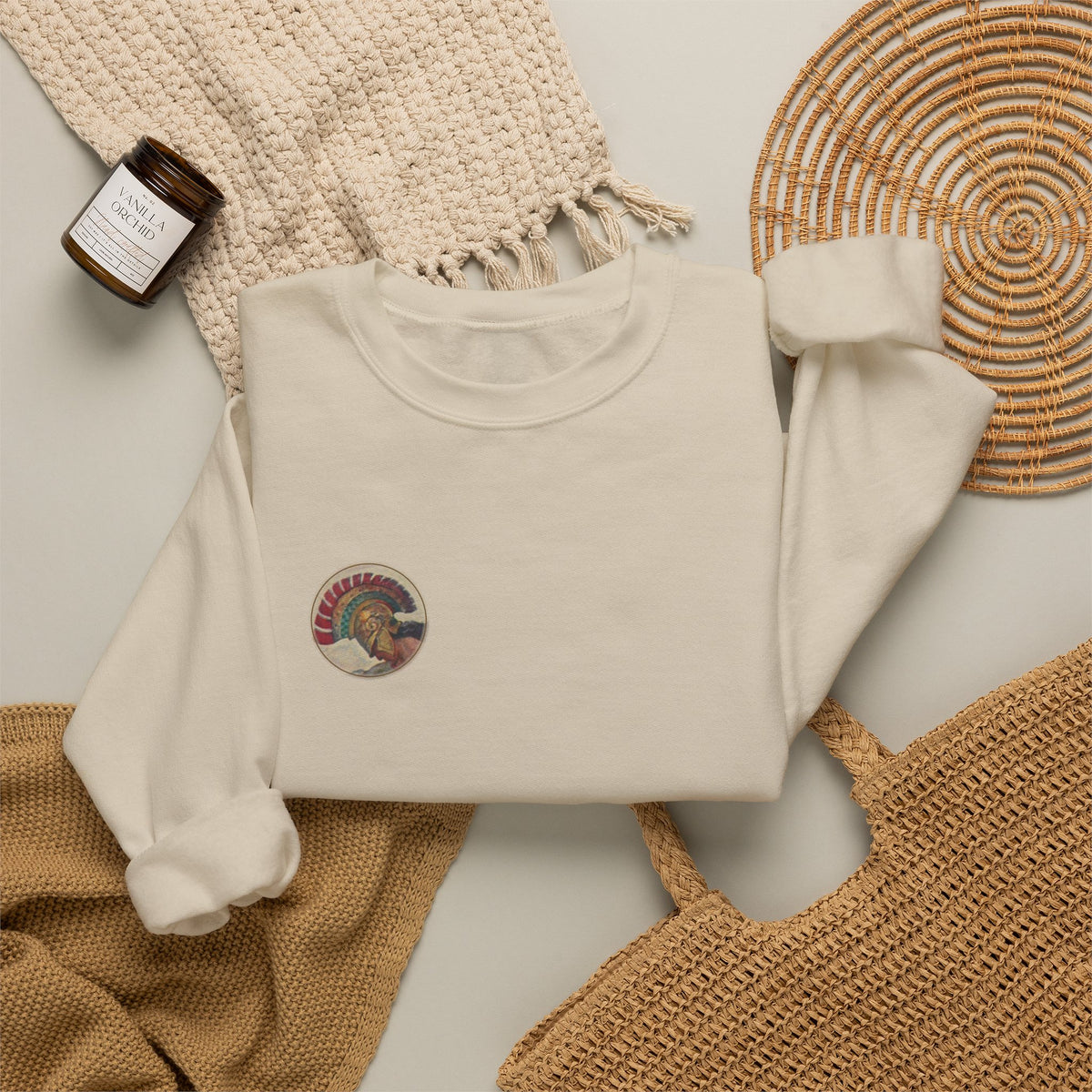 Sand Athena Vintage sweatshirt laid flat with lifestyle props, circular Athene chest print; N. C. Wyeth, 1929, from Homer's Odyssey (public domain); Old Heaven.