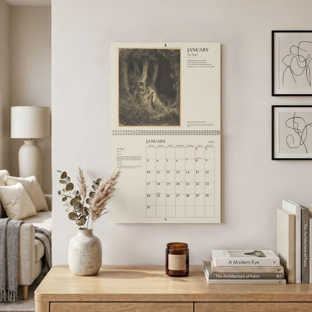 The 2027 Doré wall calendar hanging open on a living-room wall at January, with Doré’s engraving of Dante lost in the dark wood above the month grid